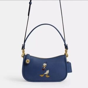 Disney x Coach collabo Swinger Bag / Donald Duck Stone Blue